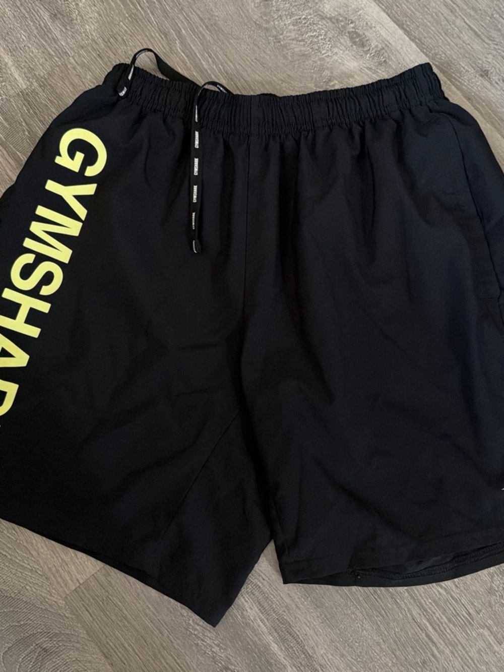 Gymshark Black Athletic Shorts with Yellow Side Logo